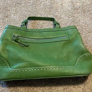 Coach Vintage green bag- small dots on back- have not tried to clean- leather